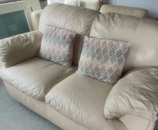 Two seater cream leather sofa