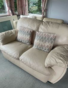 Two seater cream leather sofa