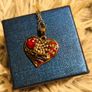 Heart-Shaped Pendant Necklace with Red Glass Heart and Wing Details Image 6