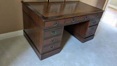 Traditional mahogany pedestal desk with leather inlay