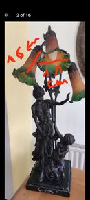 a beautiful old lamp with three lampshades, a mother and child.
