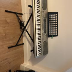 Casio WK-3300 Keyboard with adjustable stand.