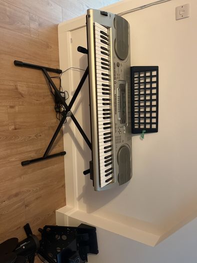 Casio WK-3300 Keyboard with adjustable stand.