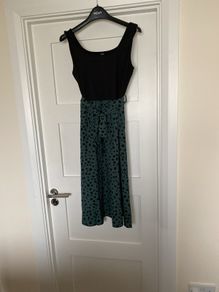 Women's dress just below knee length