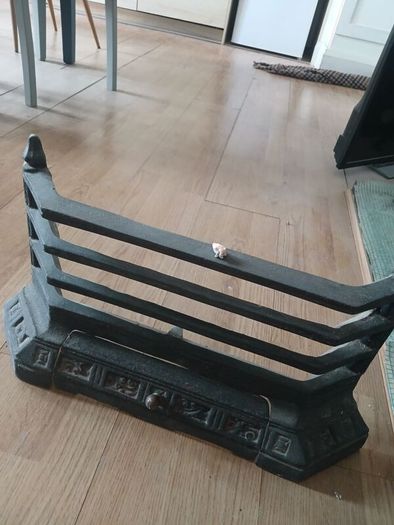 A Victorian style cast iron Fireplace with wooden surround (painted white) and black marble hearth.   Perfect condition