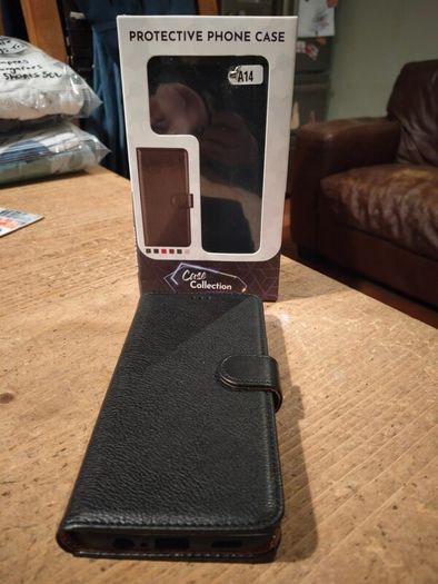 Black Multi functional phone case.  New in box.