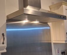 Large extractor fan and splashback