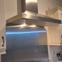 Large extractor fan and splashback