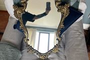 Baroque style vintage gold wall mirror. Size approx 20in x 29in.