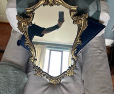 Baroque style vintage gold wall mirror. Size approx 20in x 29in.