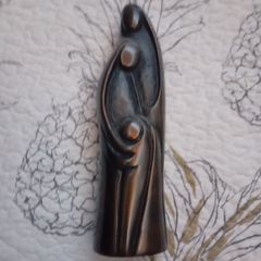 soapstone sculpture mother father child