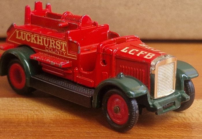 4 vintage toy cars -