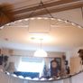 Vintage Art Deco Mirror. Scalloped bevelled edge frameless round wall mirror. Ready to hang on original visible chain. 25" x 15" Image 3