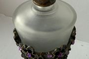 Vintage-style frosted glass perfume bottle.