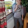 Grey, feet printed trousers.  Age 9-10 Image 2