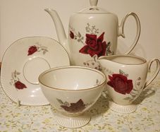Vintage Chocolate Porcelain Red Rose Design.