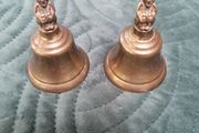 2 X small Brass Bells with figurine on top.