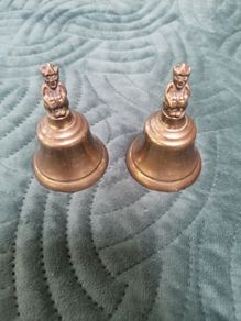 2 X small Brass Bells with figurine on top.