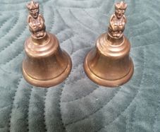 2 X small Brass Bells with figurine on top.
