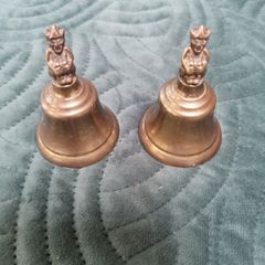 2 X small Brass Bells with figurine on top.