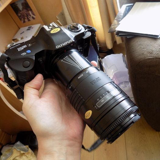 Old heavy Olympus OM101 Camera with lens.