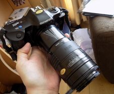 Old heavy Olympus OM101 Camera with lens.