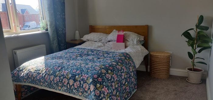 Varnished pine double bed frame.