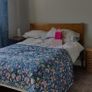 Varnished pine double bed frame. Image 2