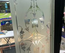 Acid etched glass panel