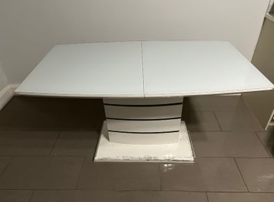 Extendable dining table with white glass top