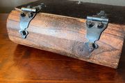 antique A wooden box in the form of a book, having brass escutcheon and black metal hinges. 18 x 15cm.