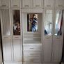 Double bedroom wardrobe with drawers and mirror in-between wardrobes and plenty of storage above Image 2