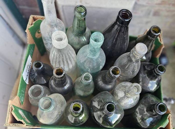 Box of Vintage Bottles and Schweppes Soda Syphon