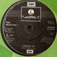 Paul McCartney - Coming Up. Irish seven inch single from 1980 with green EMI Irish cover. Die Cut Centre version. Mint.