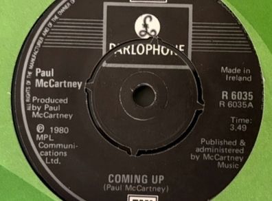 Paul McCartney - Coming Up. Irish seven inch single from 1980 with green EMI Irish cover. Die Cut Centre version. Mint.