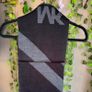 Authentic Michael Kors reversible knit scarf in charcoal black/heather grey with oversized MK logo detail. Image 4