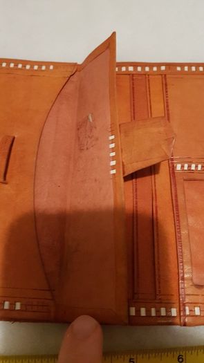 handcrafted made soft leather wallet,with designs ,, thank you,,was used,some wear and tear,,take as is ..