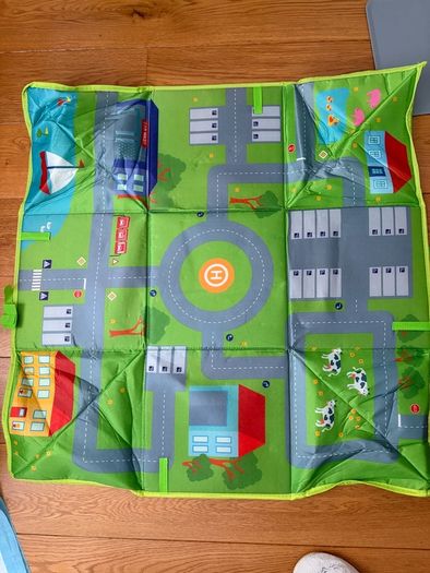 three toy cars playing mats
