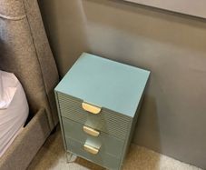 Pair of Harvey Norman Frankie bedside lockers in green with gold handles and legs.