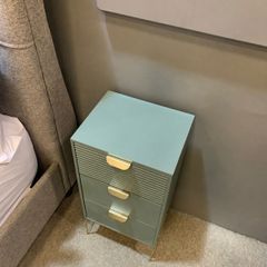Pair of Harvey Norman Frankie bedside lockers in green with gold handles and legs.