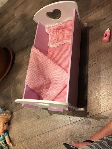 Doll crib with a baby