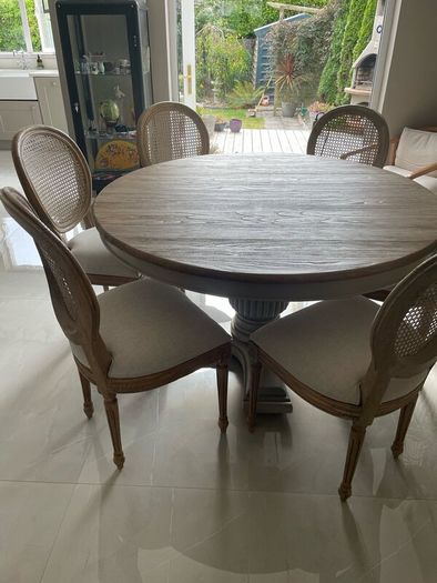 Dining table round 140cm with 6 rattan back chairs