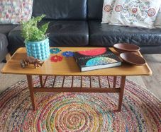 Unusual and Practical Mid-Century Modern Wooden Coffee Table with a Hard-Wearing Wood-Patterned Melamine Top and Slatted Magazine Shelf
