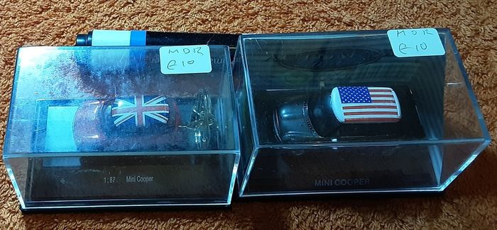 two clear boxed mini's
