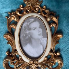 Retro Elegance golden frame at table for an antique touch.