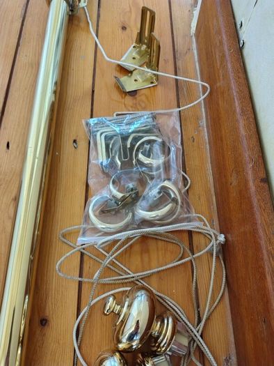 Brass coloured curtain track
