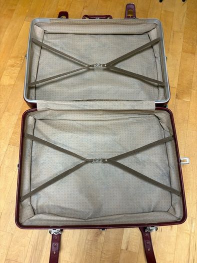 Vintage burgundy faux-leather suitcase