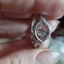 A 925 sterling silver ring with a floating diamond centerpiece. Image 4