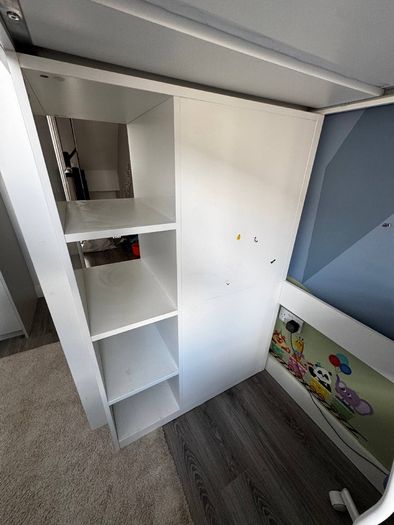 Bed with wardrobe and desk