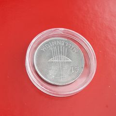Millennium 1 pound coin in case